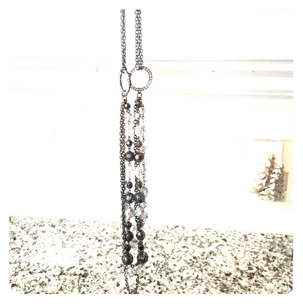 Long necklace with sparkly beads.